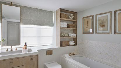 beige bathroom with tub, sink and open shelving