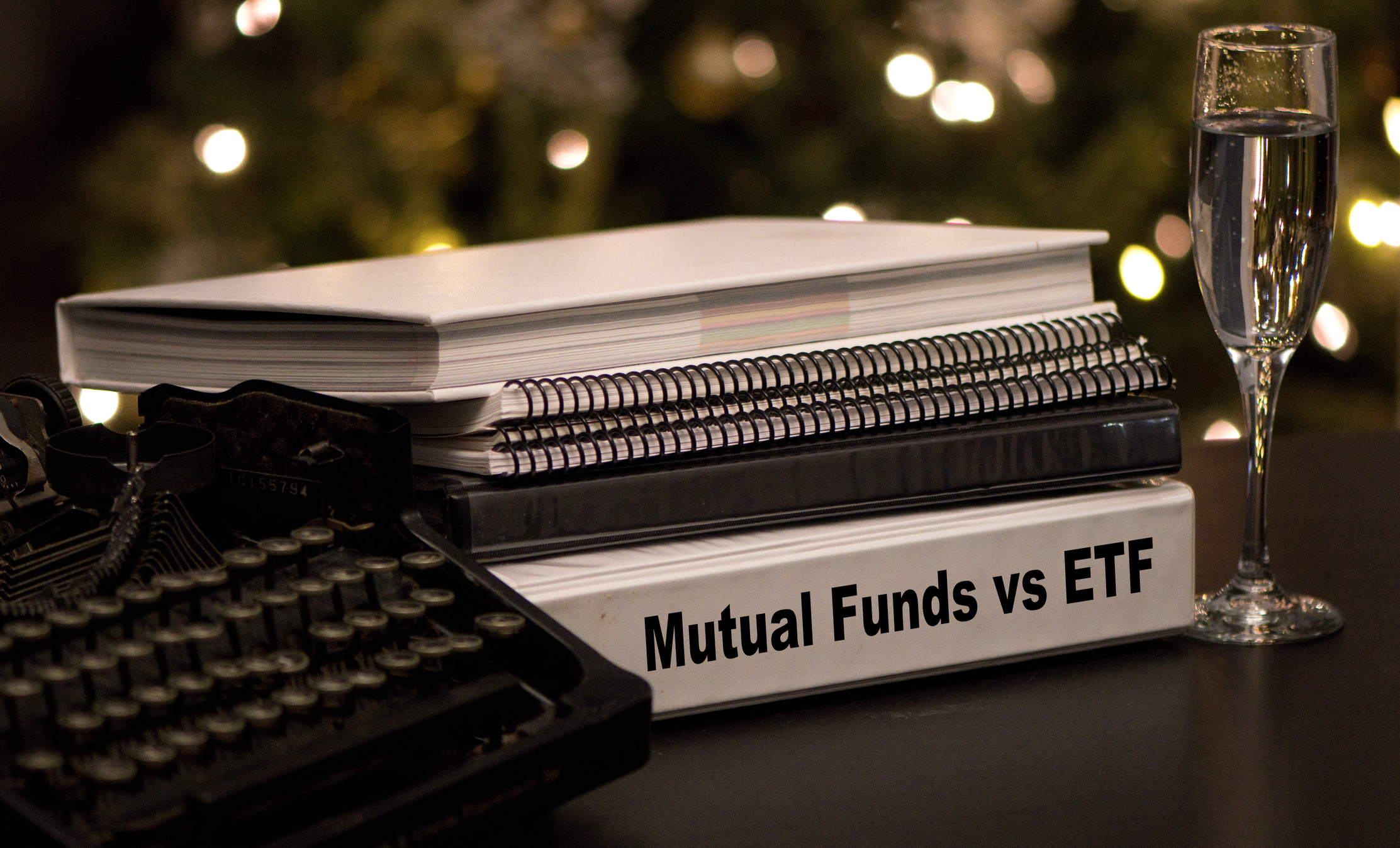 a white binder with the words "mutual funds vs e3tfs" written in black lettering on the side