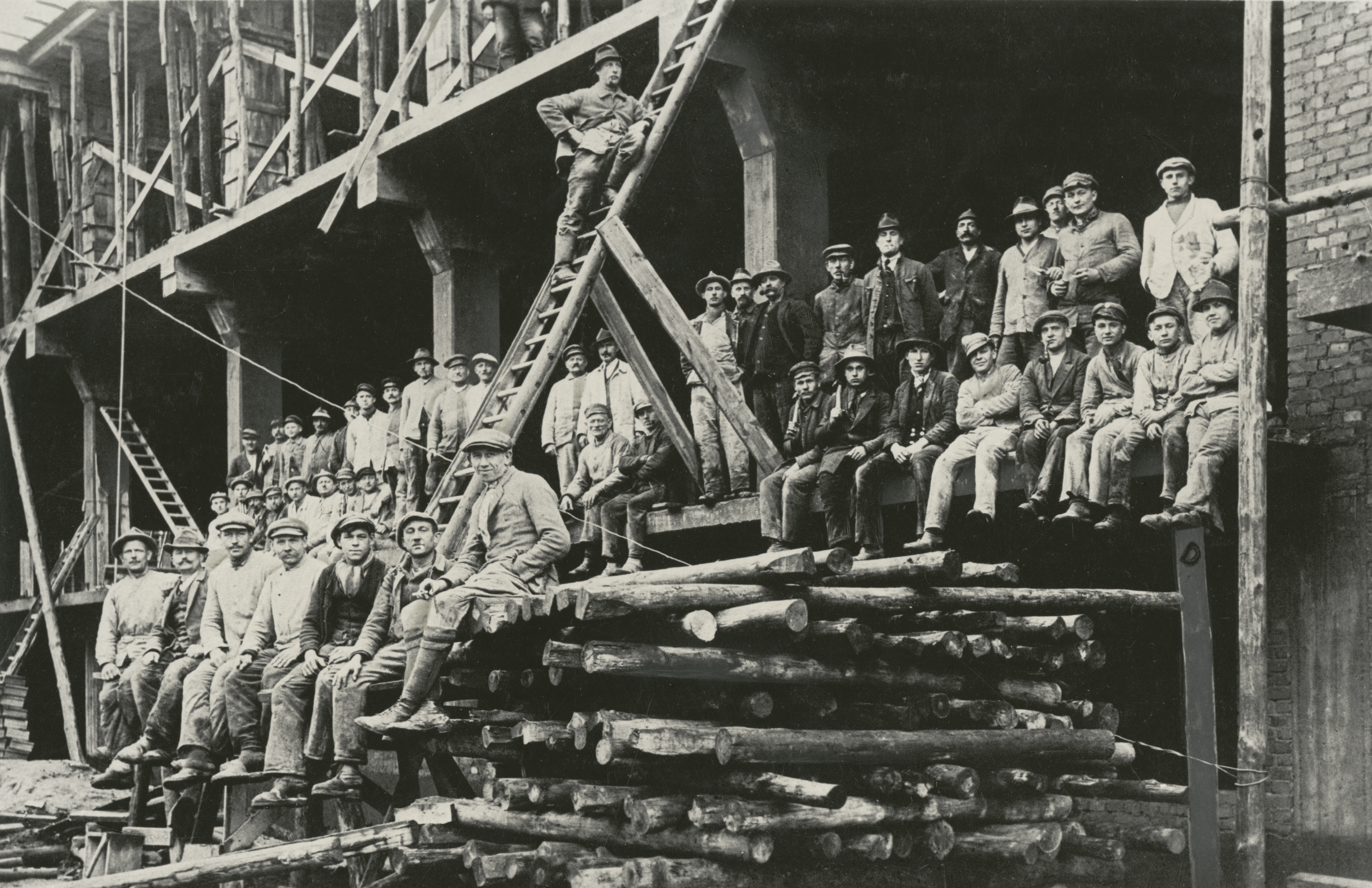 Construction workers in the shell of the workshop wing of the Bauhaus building in Dessau, 1926