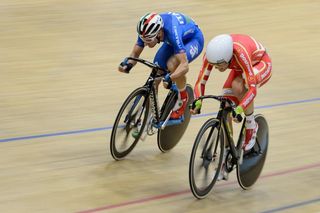 Gold medalist Elia Viviani of Italy (L) competes with silver medalist Lasse Norman Hansen of Denmark during the Men's Omnium competition at the Track Elite European Championships