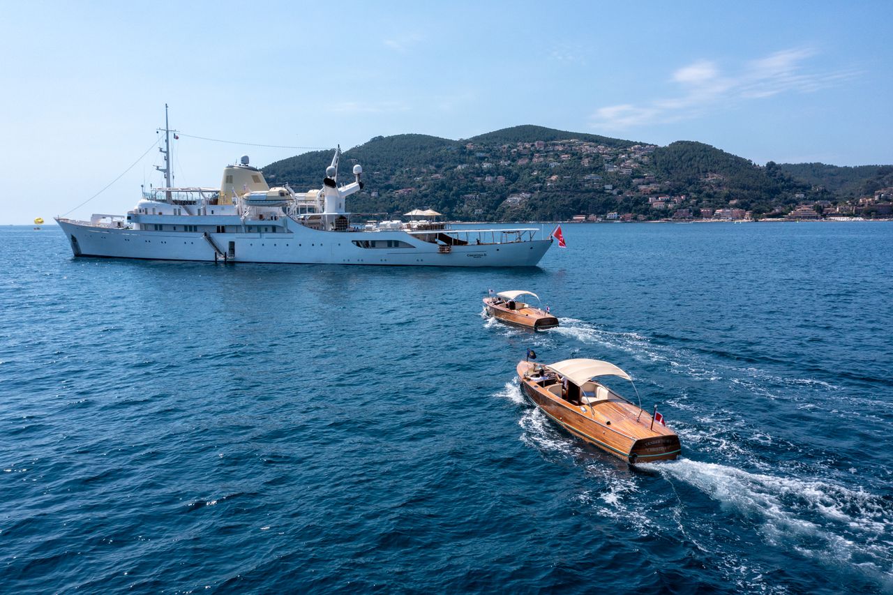 Two tenders motor towards Christina O