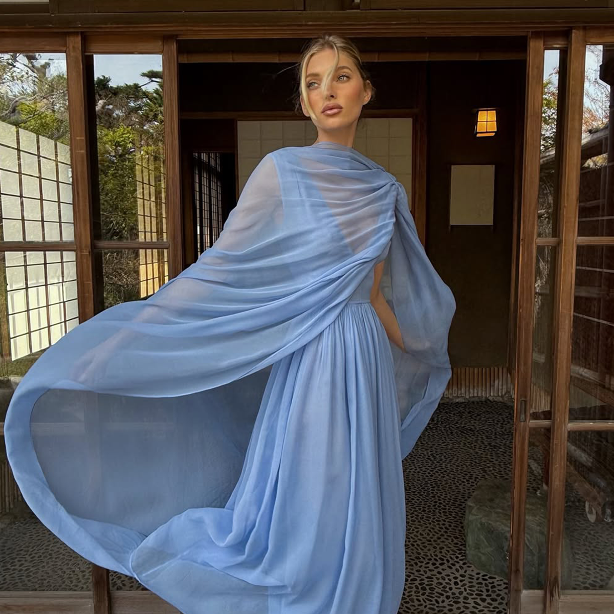 Elsa Hosk wearing a light-blue Helsa cape dress