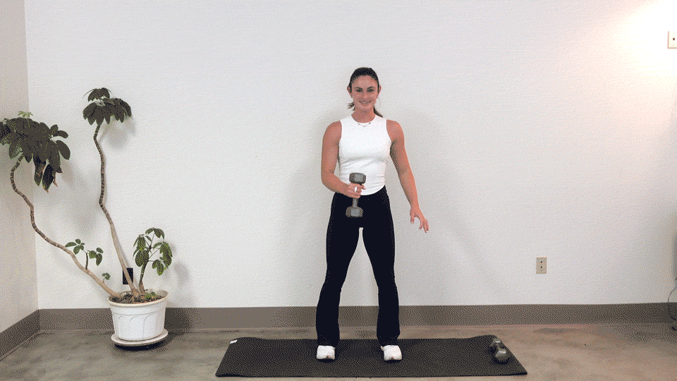 Trainer Kirra Mitlo doing dumbbell around the worlds