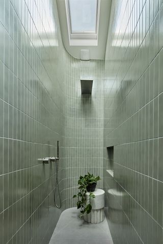 a small shower room with a skylight