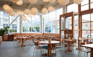 Tartine Manufactory with tables and paper lanterns