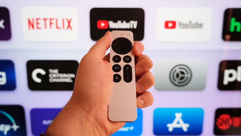 The Apple TV 4K (2022) remote in front of a TV with the tvOS home screen.