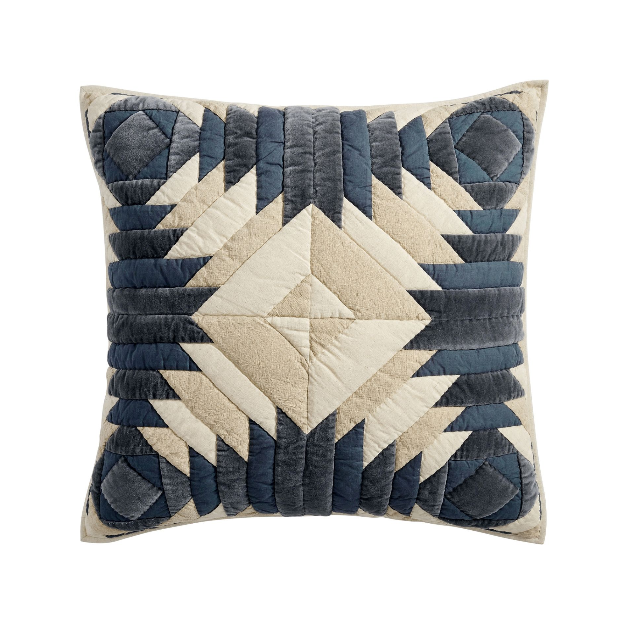 a blue, white, and cream patchwork pillow sham