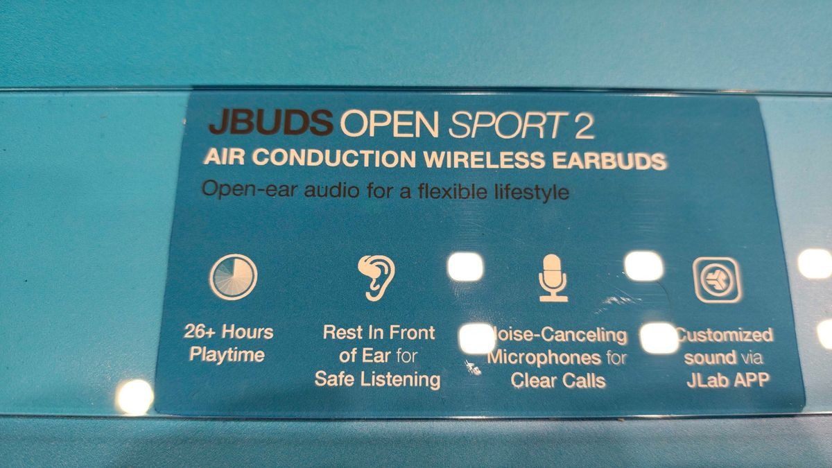 JLab's new earbuds at IFA, on a blue table