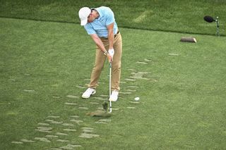 Rory McIlroy hits an iron off the tee