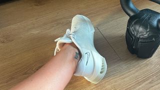 Nike Metcon 9 on writer's foot