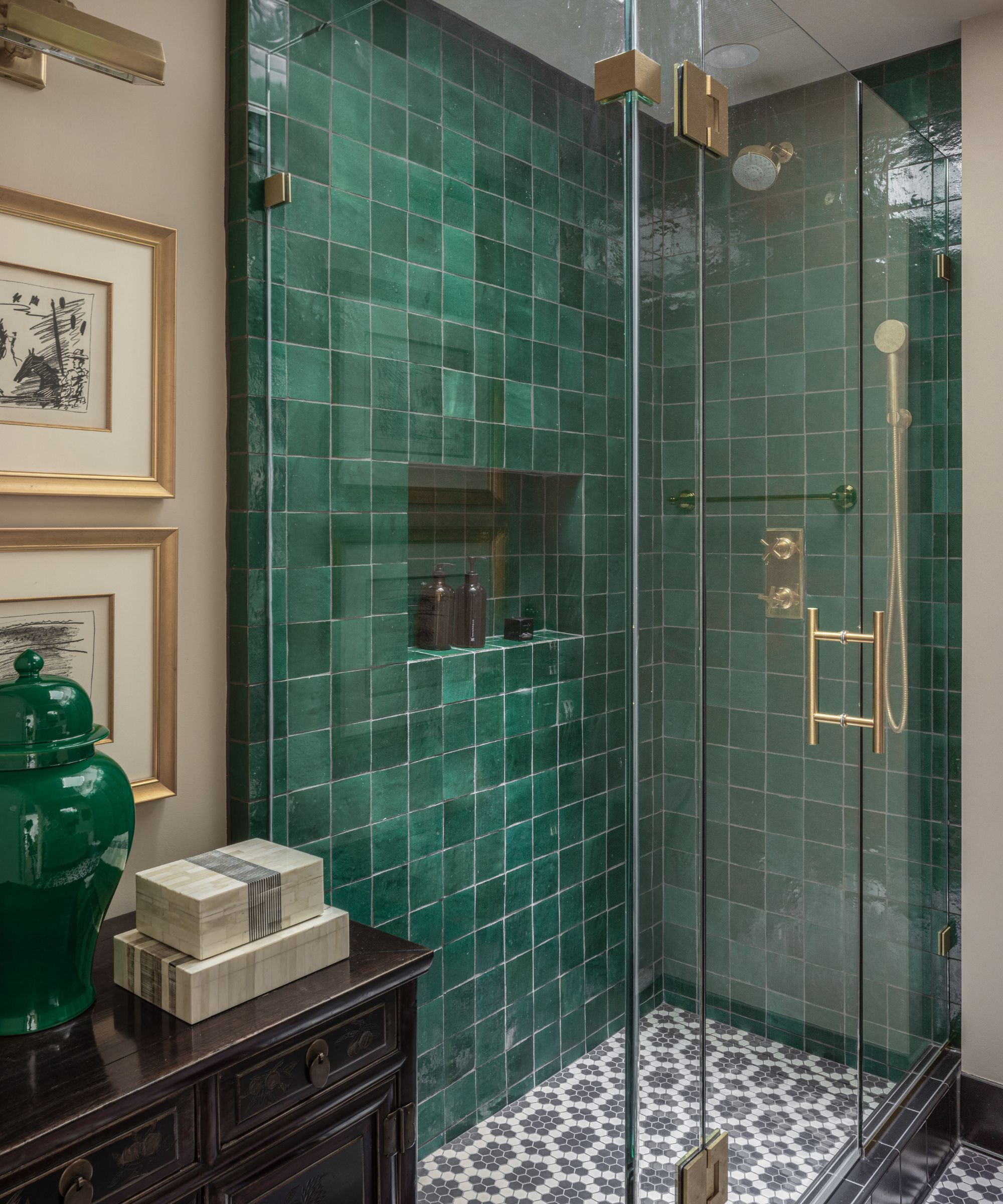 A small bathroom with a green tile shower area and Sherwin-Williams Natural Linen on the walls