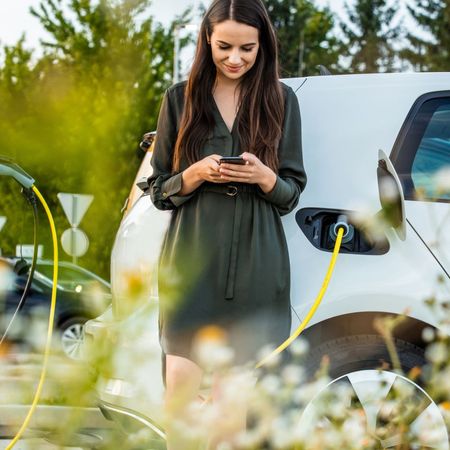 A woman driving an electric vehicle 
