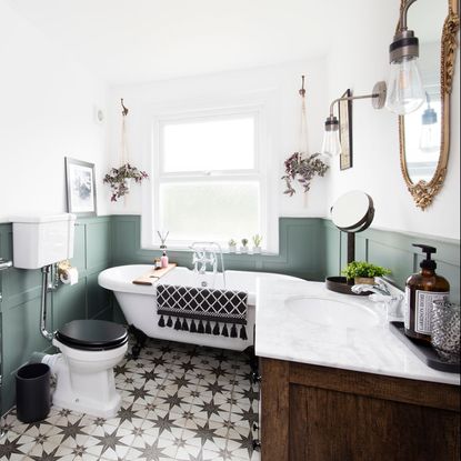 bathroom with white tub and wall mirror