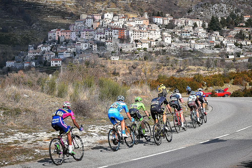 The peloton rides through the French countryside during stage 6 at Paris-Nice.