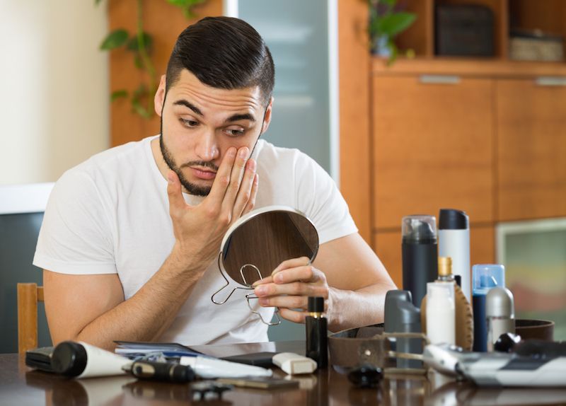 Man looking in mirror