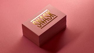 Pink and gold business cards with Snask logo