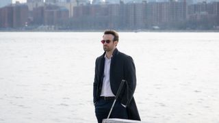 Matt Murdock walking alongside a body of water in Daredevil: Born Again