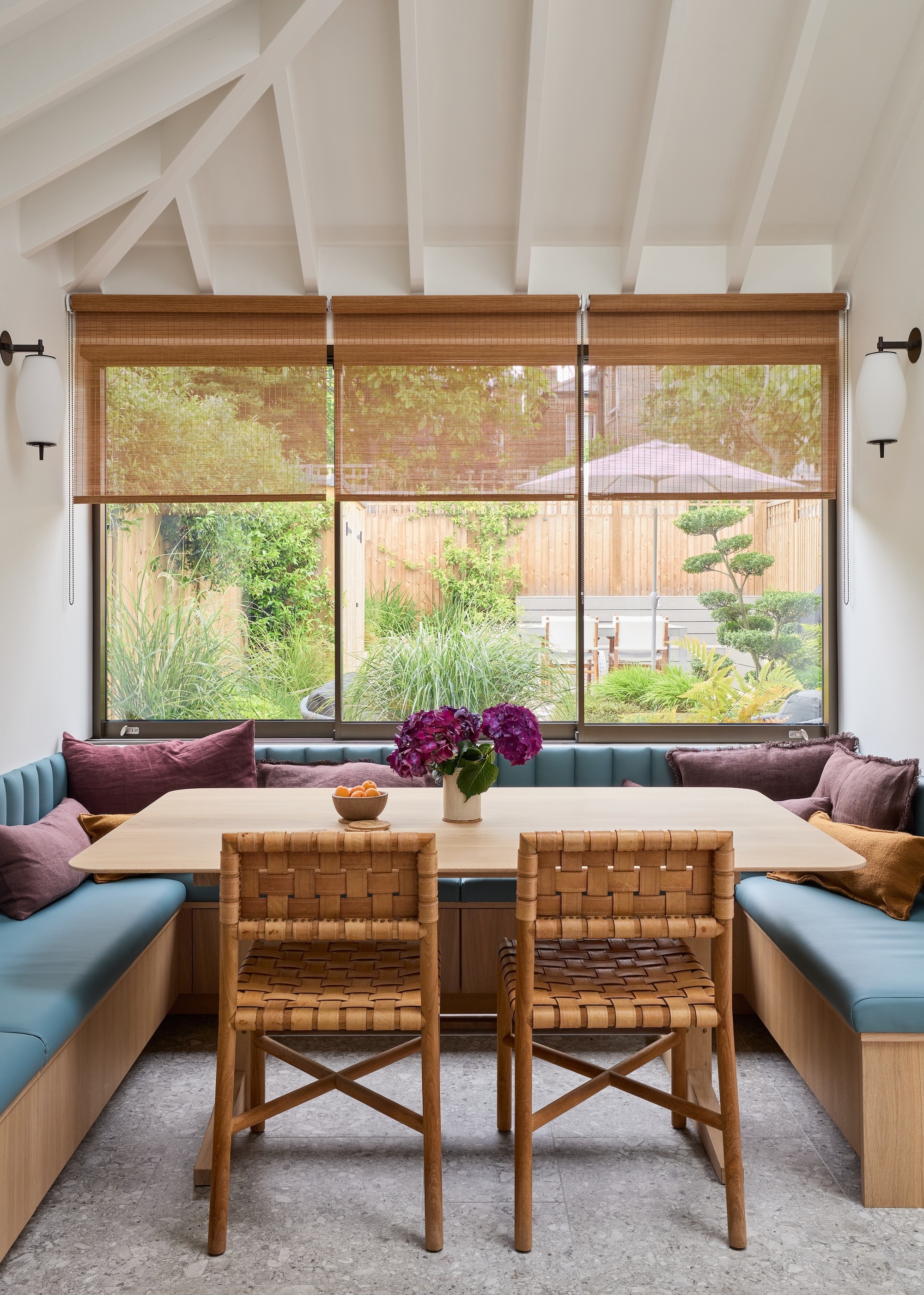 banquette seating with blue seating pads in an alcove