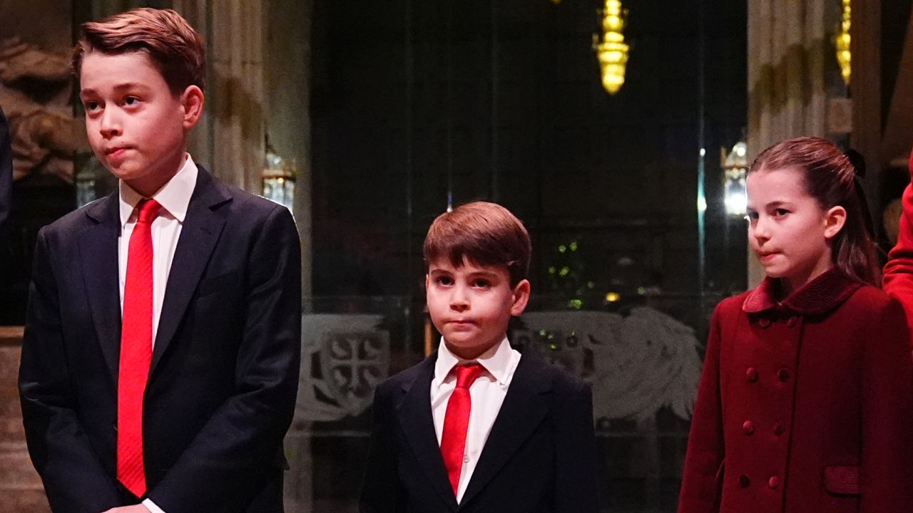 Prince George and Prince Louis wear matching suits with white shirt and red ties, while Princess Charlotte wears a red coat to attend Kate Middleton&#039;s Christmas carol concert