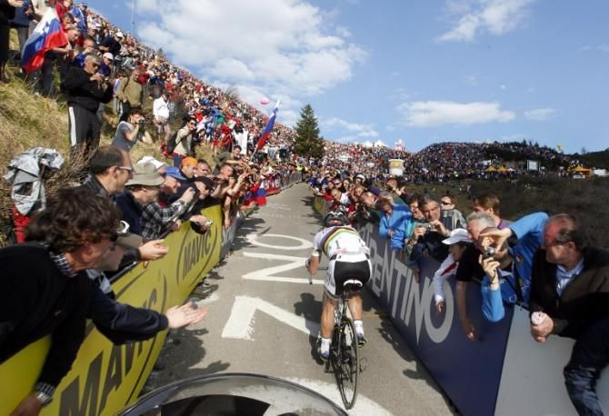 Cadel Evans struggles to the top of the climb