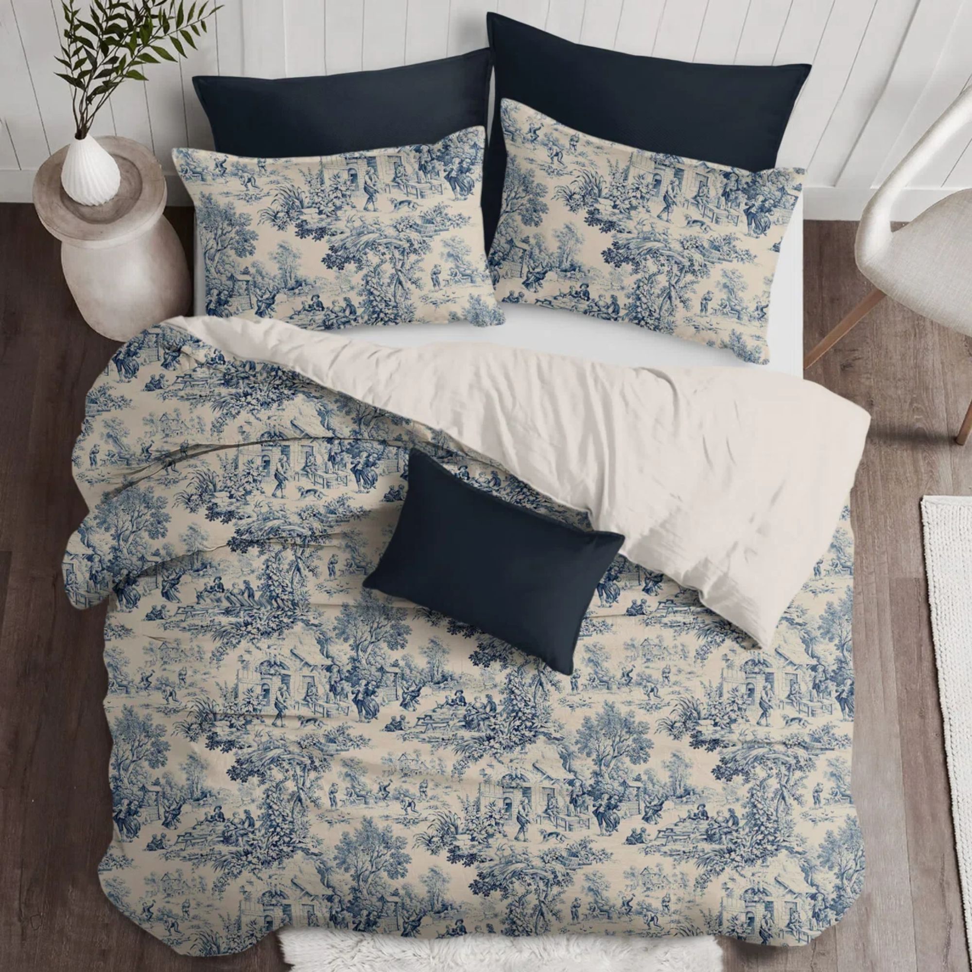 Blue and white toile bedding with navy cushions