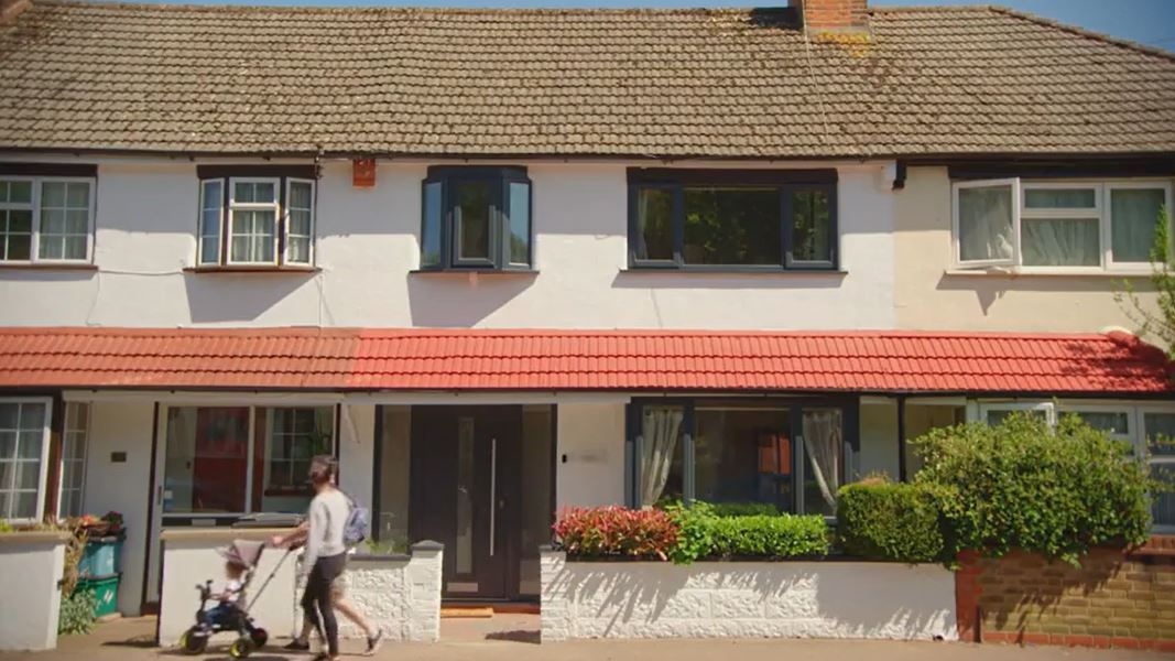 The exterior of the house with its uPVC windows sprayed in anthracite grey