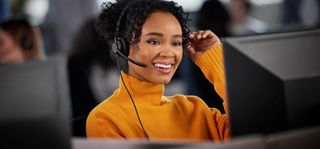 A happy contact center enjoys the Jabra headsets from the Engage line.