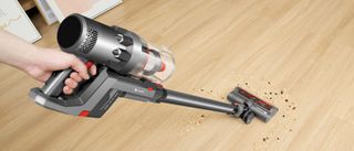 The Proscenic P11 cordless vacuum cleaner being used to clean hard floors