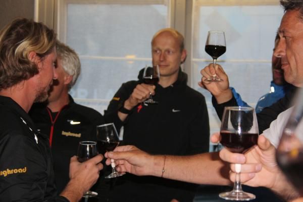 The team staff toast Cav's stage win