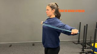 Pippa Sealey performs banded pull-aparts with a resistance band