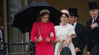 Princess Beatrice and Princess Eugenie arrive for the Sovereign's Garden Party at Buckingham Palace on May 21, 2024