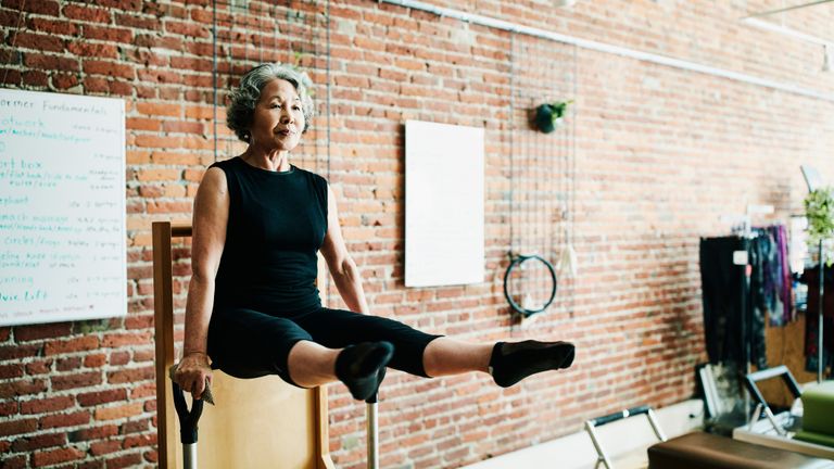 Core exercise performed by a woman over 60 to assist in balance