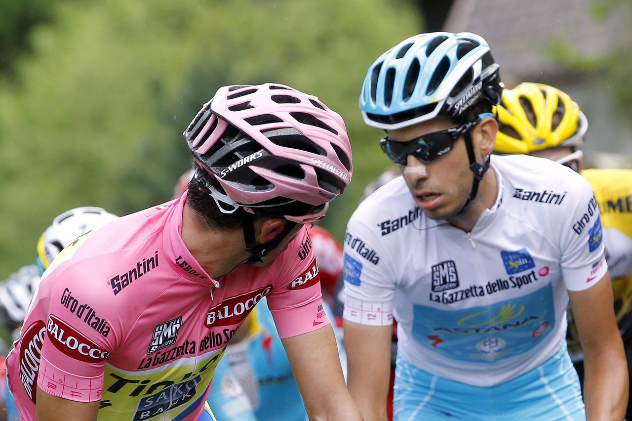 Fabio Aru (Astana) gives nothing away as Alberto Contador tries to read his face
