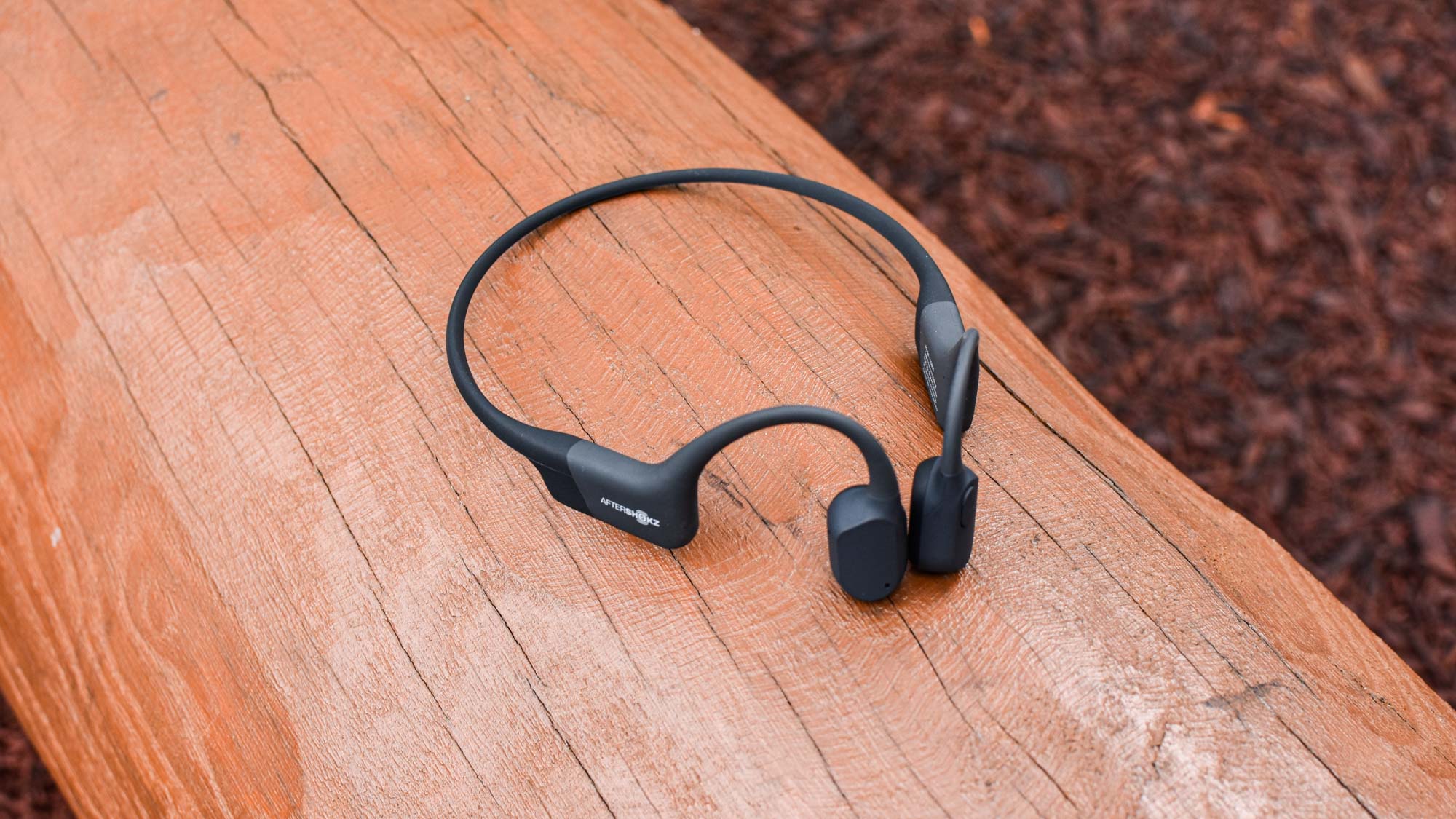 The AfterShokz Aeropex displayed on a wooden table