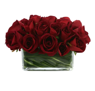 Artificial red rose arrangement.
