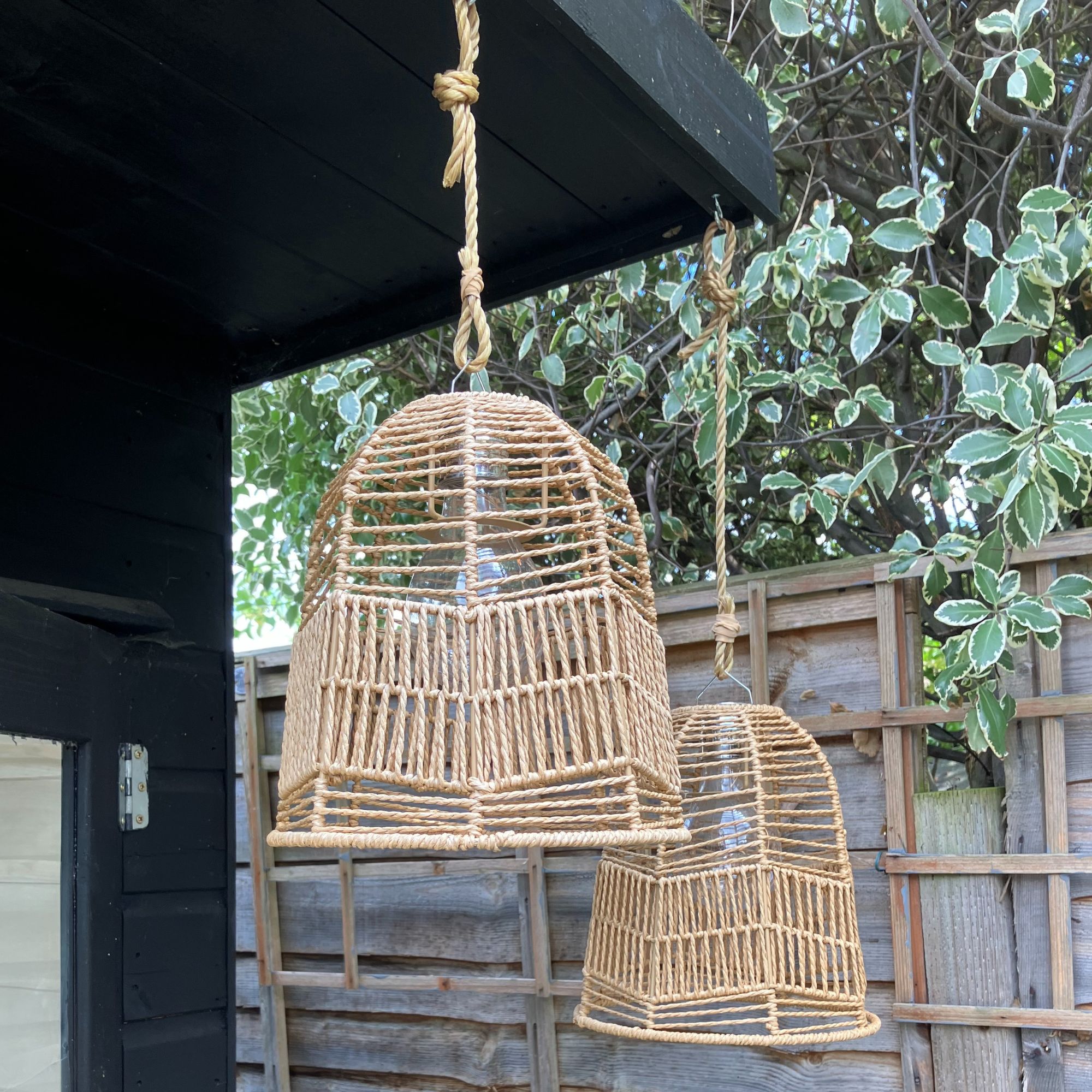 outdoor woven hanging lights and fence