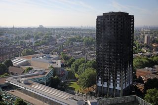 LONDON, ENGLAND - JUNE 15:Grenfall tower continues to smoulder on June 15, 2017 in London, England. At least twelve people have been confirmed dead and dozens missing after the 24 storey resi
