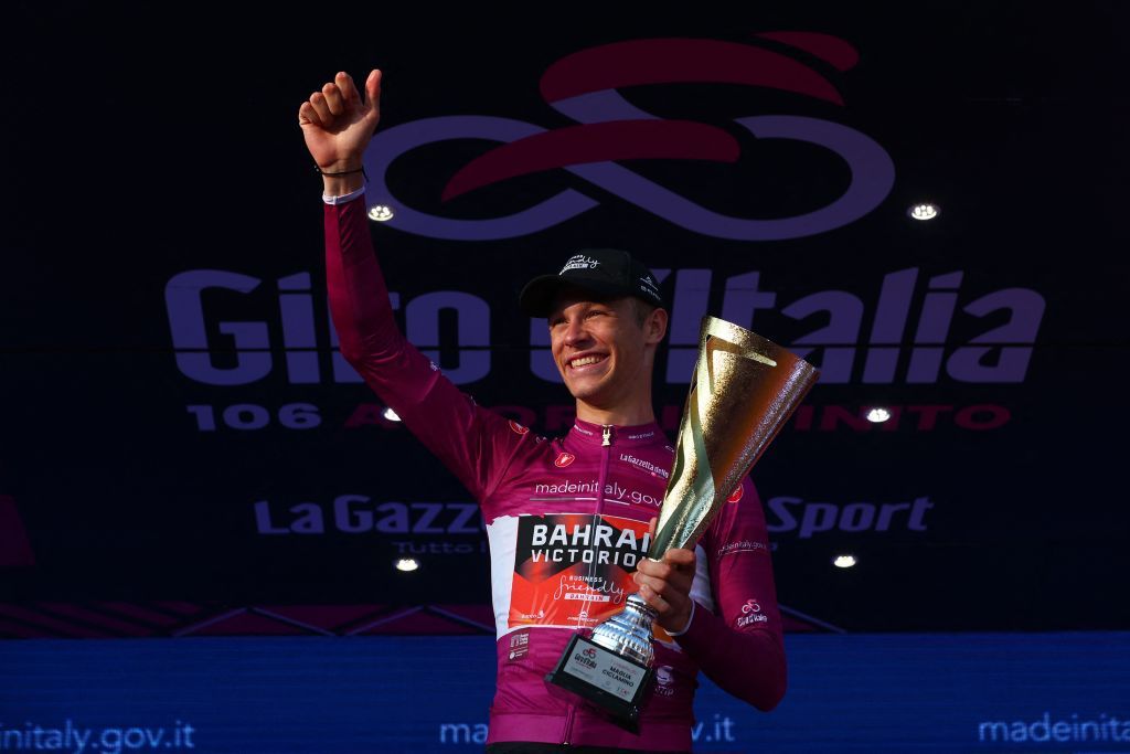 Bahrain Victoriouss Italian rider Jonathan Milan celebrates wining the best sprinters cyclamen jersey on the podium after the Giro dItalia 2023 cycling race in Rome on May 28 2023 Photo by Luca Bettini AFP Photo by LUCA BETTINIAFP via Getty Images