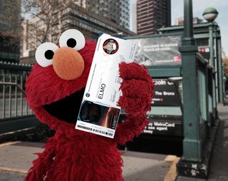 Sesame Street's Elmo shows off a boarding pass for NASA's Orion spacecraft test flight in support of the agency's Exploration Flight Test 1 launching in December 2014. The "I'm On Board" boarding passes were part of a social outreach and media project to spur interest in the mission.