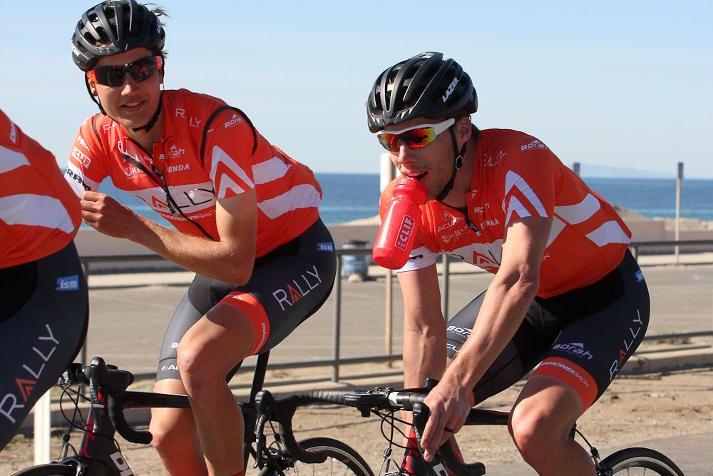 Tom Soladay grabs a bottle while new recruit Adam De Vos looks on.