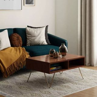 WyndenHall Moreno Solid Mango Wood Lift Top Coffee Table in living room with neutral rug, blue sofa and mustard throw