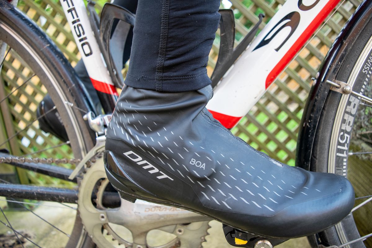 A cyclist wearing a pair of DMT WKR1 shoes