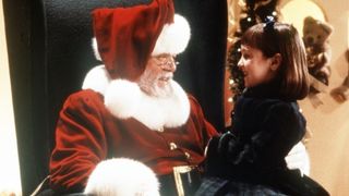 Richard Attenborough as Father Christmas sits with Susan in Miracle on 34th Street