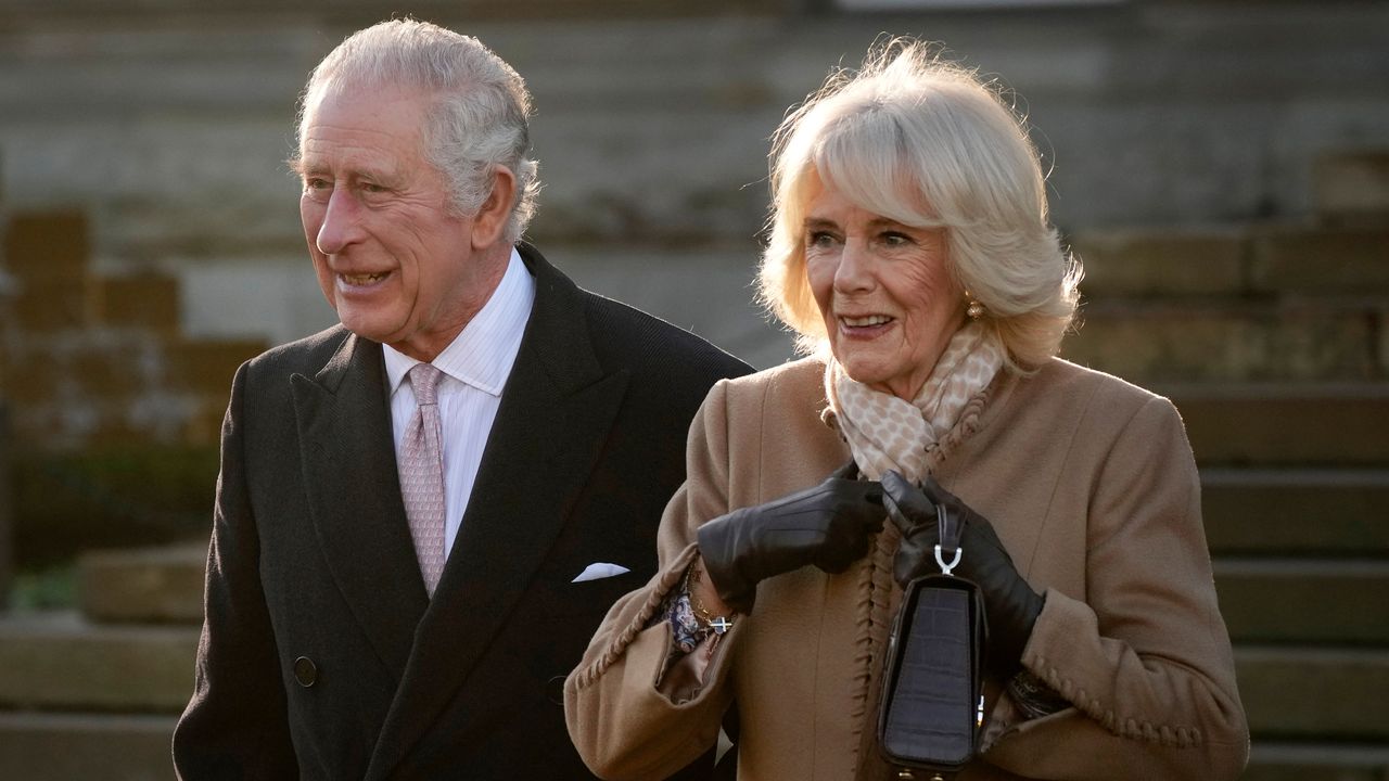 What&#039;s going on between King Charles and Queen Camilla in throwback photo revealed. Seen here the royals leave Bolton Town Hall