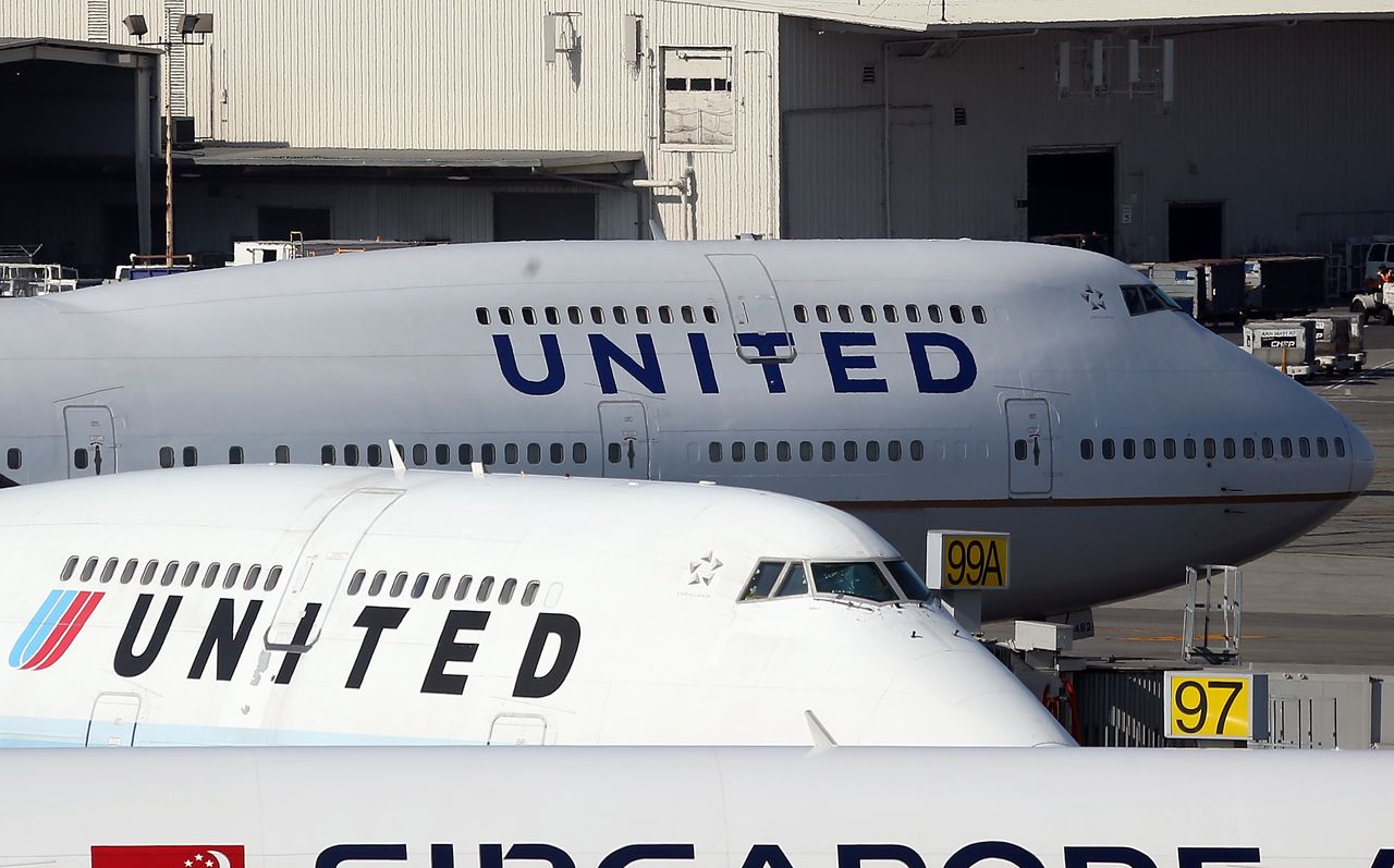 A United Airlines plane waits on the tarmac