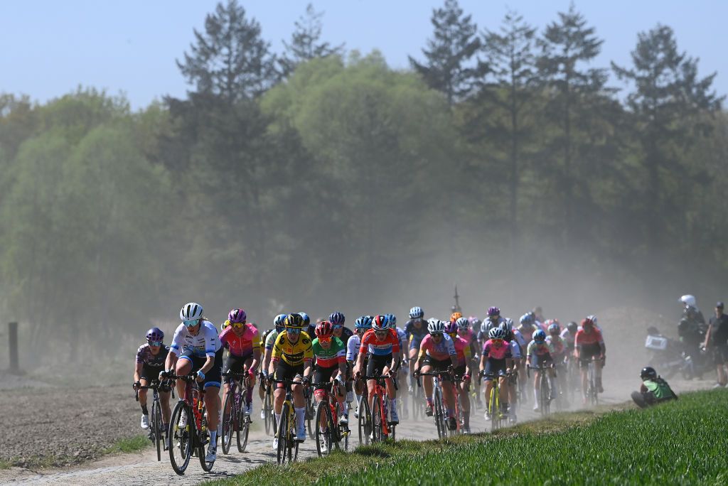 ROUBAIX FRANCE APRIL 16 A general view of Ellen Van Dijk of Netherlands and Team Trek Segafredo Chantal Van Den Broek Blaak of Netherlands and Team SD Worx Lucinda Brand of Netherlands and Team Trek Segafredo Elisa Balsamo of Italy and Team Trek Segafredo Christine Majerus of Luxembourg and Team SD Worx and the peloton compete passing through a dusty cobblestones sector during the 2nd ParisRoubaix 2022 Womens Elite a 1247km one day race from Denain to Roubaix ParisRoubaixFemmes ParisRoubaix on April 16 2022 in Roubaix France Photo by Tim de WaeleGetty Images