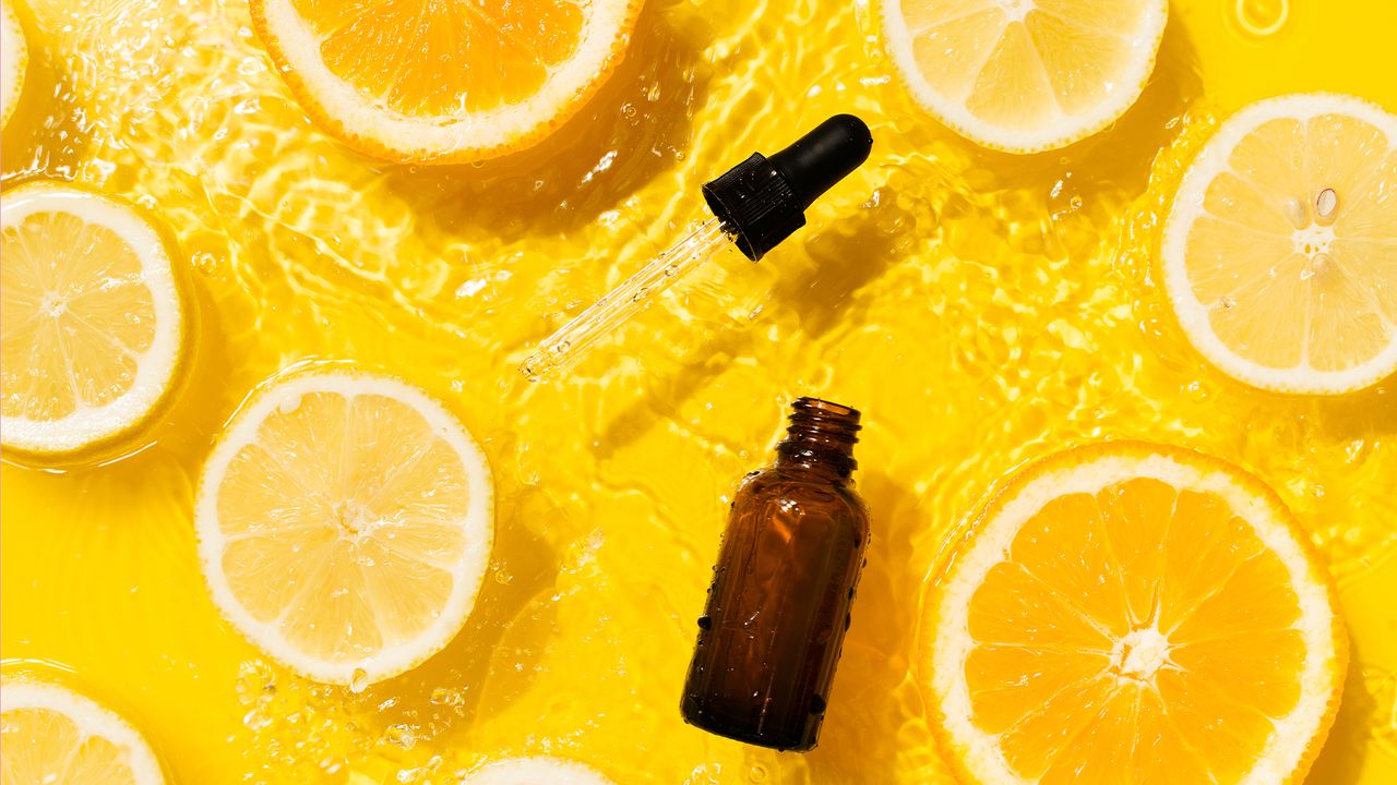 bottle of serum on orange slices