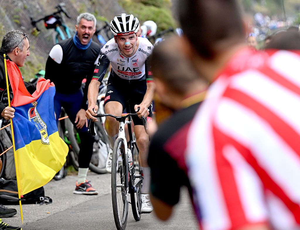 L&#039;ANGLIRU, SPAIN - SEPTEMBER 05: Stage winner Joao Almeida of Portugal and UAE Team Emirates - XRG competes climbing to the L&#039;Angliru while fans cheer during the La Vuelta - 80th Tour of Spain 2025, Stage 13 a 203.7km stage from Cabezon de la Sal to L&#039;Angliru 1556m / #UCIWT / on September 05, 2025 in L&#039;Angliru, Spain. (Photo by Dario Belingheri/Getty Images)