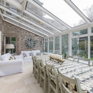 conservatory with tiles on floor and dining table