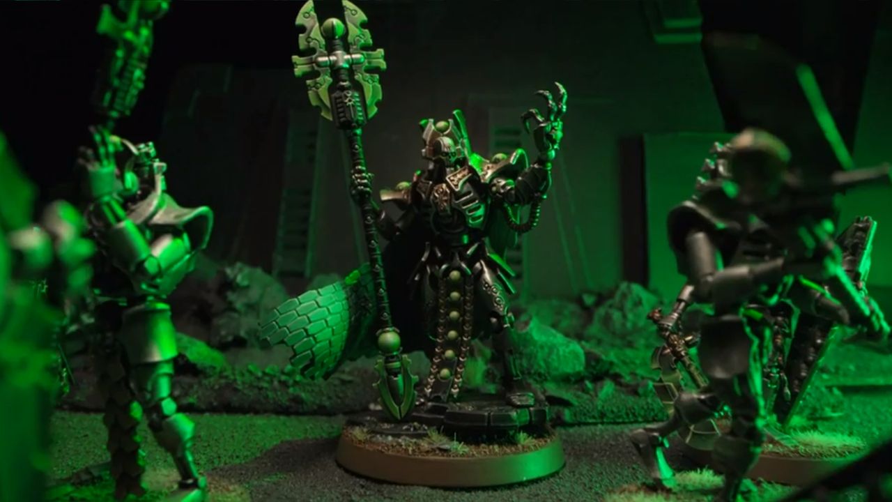A robotic Necron wielding a staff commands its army